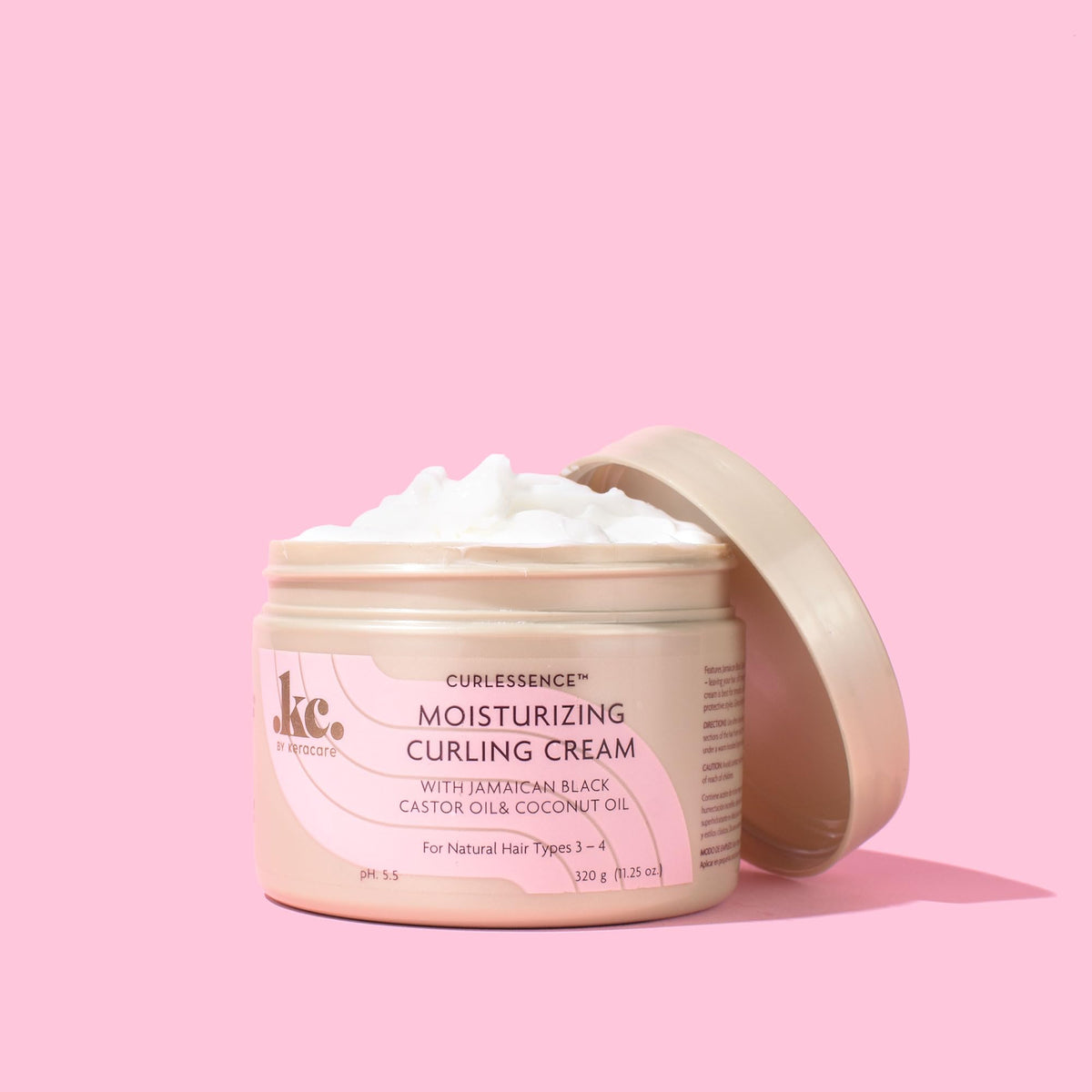 applying KeraCare cream to damp hair for improved curl formation and manageability