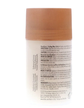 Hand applying KeraCare wax stick demonstrating easy targeted application