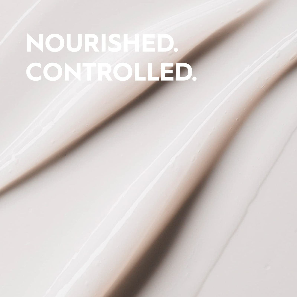 Kerasilk conditioner being applied to hands demonstrating slip and detangling benefit
