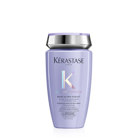 KÉRASTASE bottle front packaging showing product name and cool-tone benefit