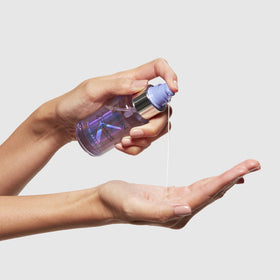 KÉRASTASE product with retail box emphasizing professional care