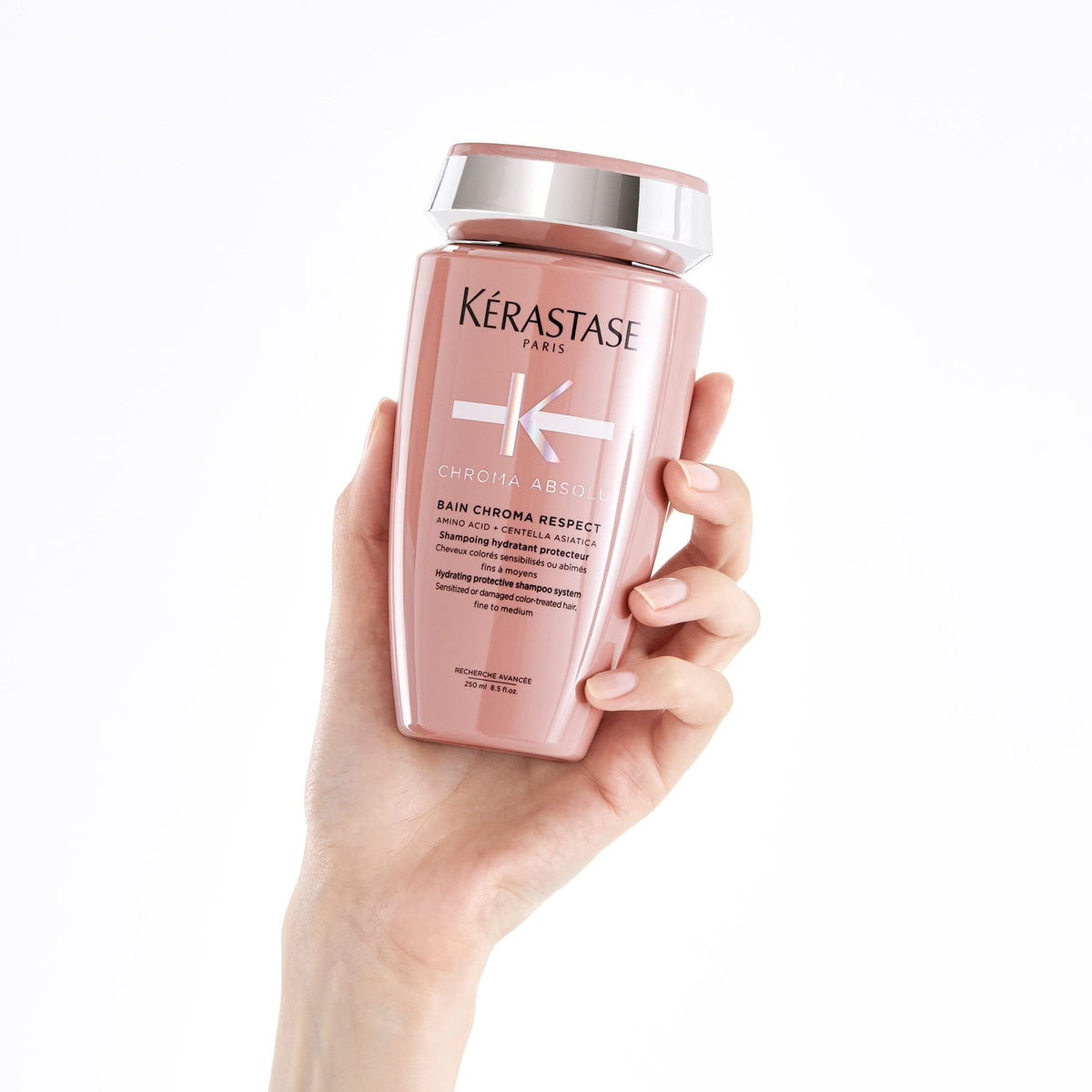 KÉRASTASE bottle paired with matching conditioner for routine