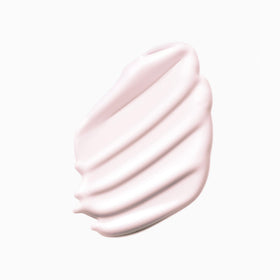 KÉRASTASE bottle next to hand for accurate 6.8 fl oz size reference