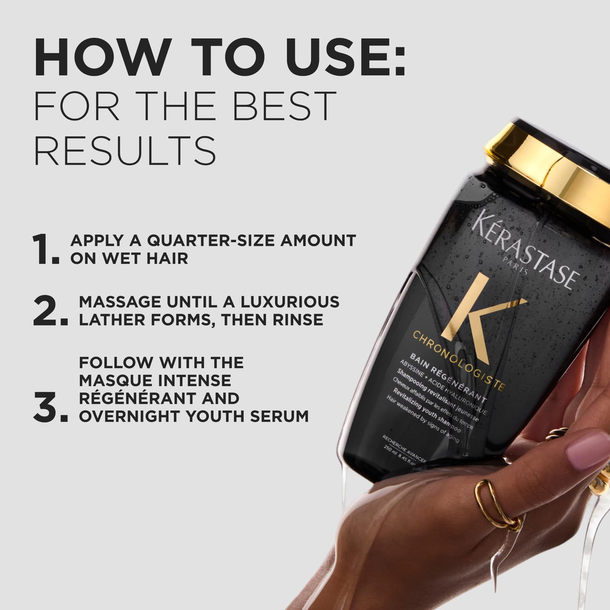 KÉRASTASE label close-up showing key ingredients hyaluronic acid and vitamin E benefit