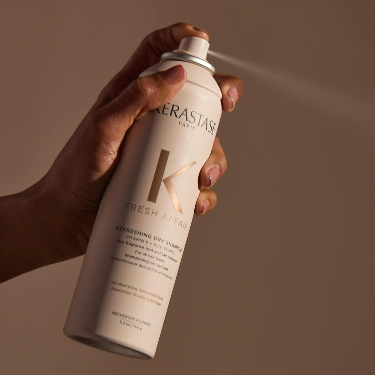KÉRASTASE on bathroom vanity, lifestyle scene showing everyday use benefit