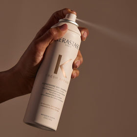 KÉRASTASE on bathroom vanity, lifestyle scene showing everyday use benefit