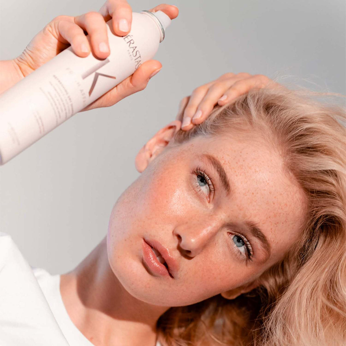 KÉRASTASE styled second-day hair, displays added volume and refreshed look