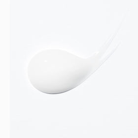KÉRASTASE next to hand to show 5.07 fl oz size and scale