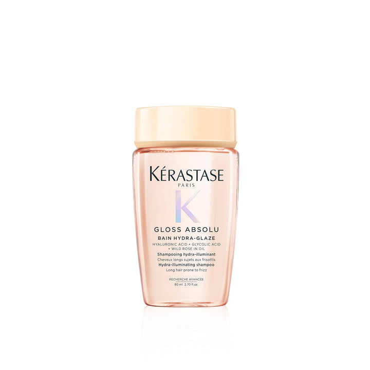 KÉRASTASE front bottle showing travel-size packaging and glossy benefit