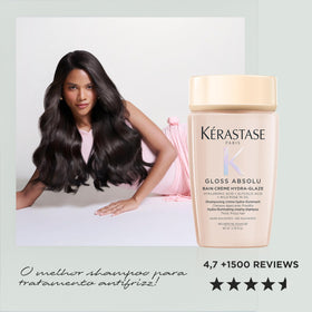 KÉRASTASE travel bottle held in hand to show 2.7 fl oz scale and easy portability advantage