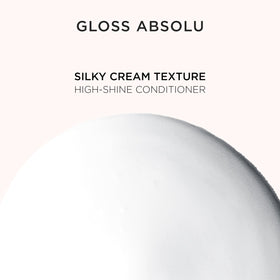 KÉRASTASE in-salon stylist applying conditioner showing professional results