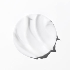 KÉRASTASE mask on a bathroom shelf illustrating salon-quality home treatment