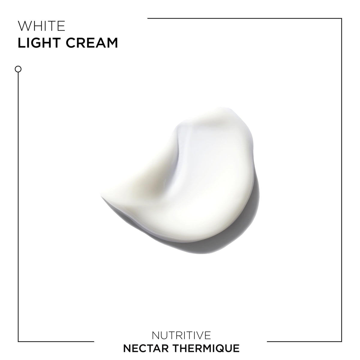 KÉRASTASE Nectar Thermique bottle shown next to hand for size and scale