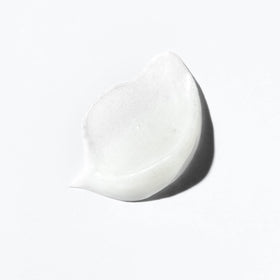 KÉRASTASE label detail focusing on ingredient callouts and application instructions benefit