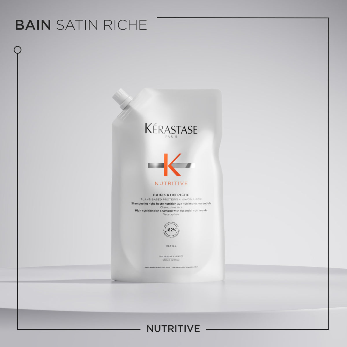 KÉRASTASE shampoo in use in shower showing smoother, manageable hair