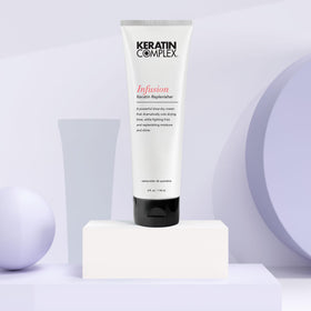 Keratin Complex in a salon-style blow-dry scene illustrating frizz control and shiny finished hair