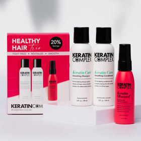 Keratin Complex shampoo and conditioner close-up pumps with visible creamy texture benefit