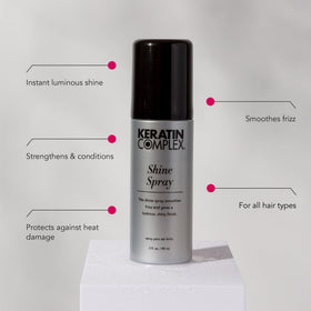 Keratin Complex spray action close-up demonstrating fine mist for even weightless shine