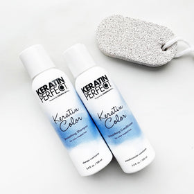 Keratin Perfect duo on bathroom shelf styled for travel-ready hair care