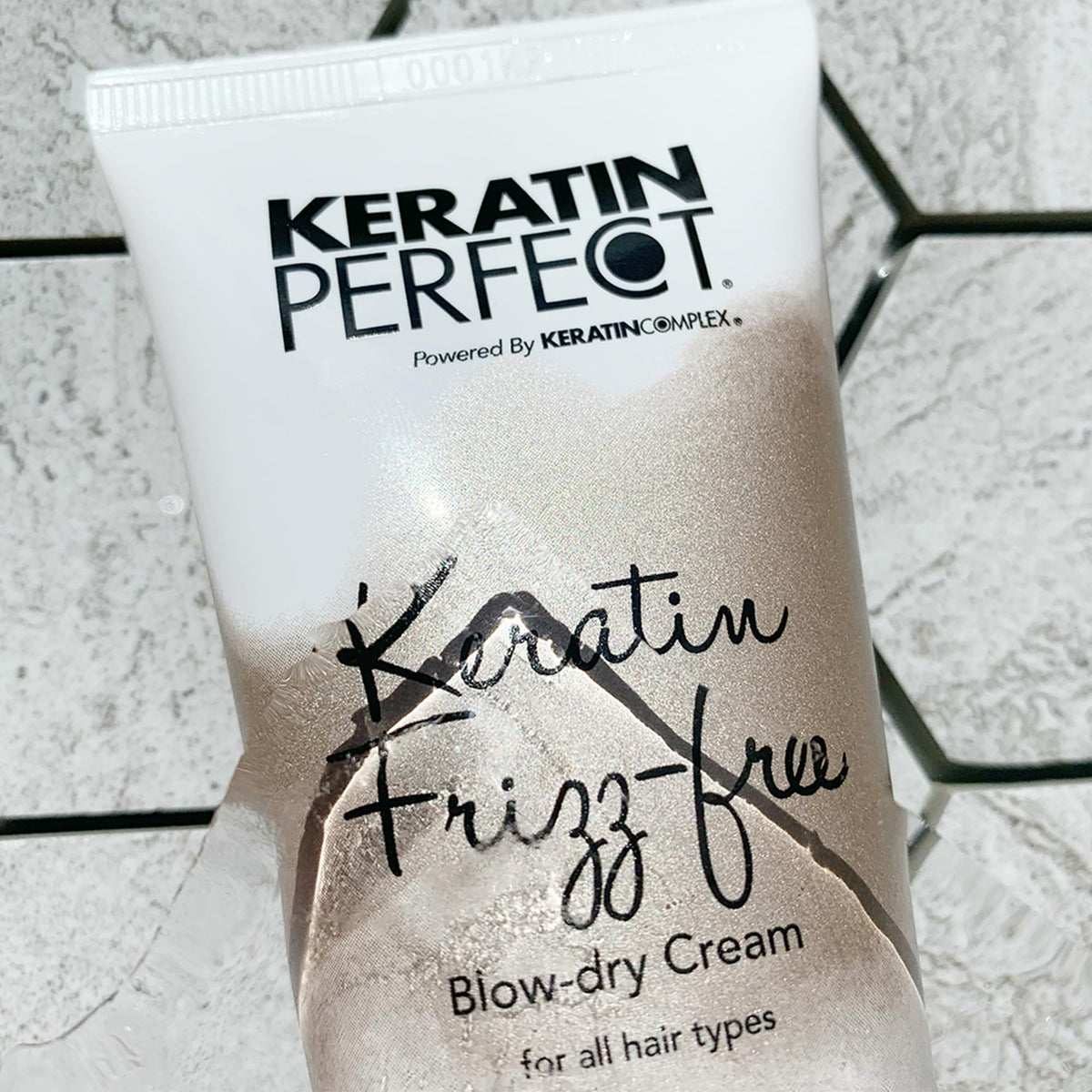Keratin Perfect inside a travel pouch with brush and clips showing on-the-go salon finish benefit