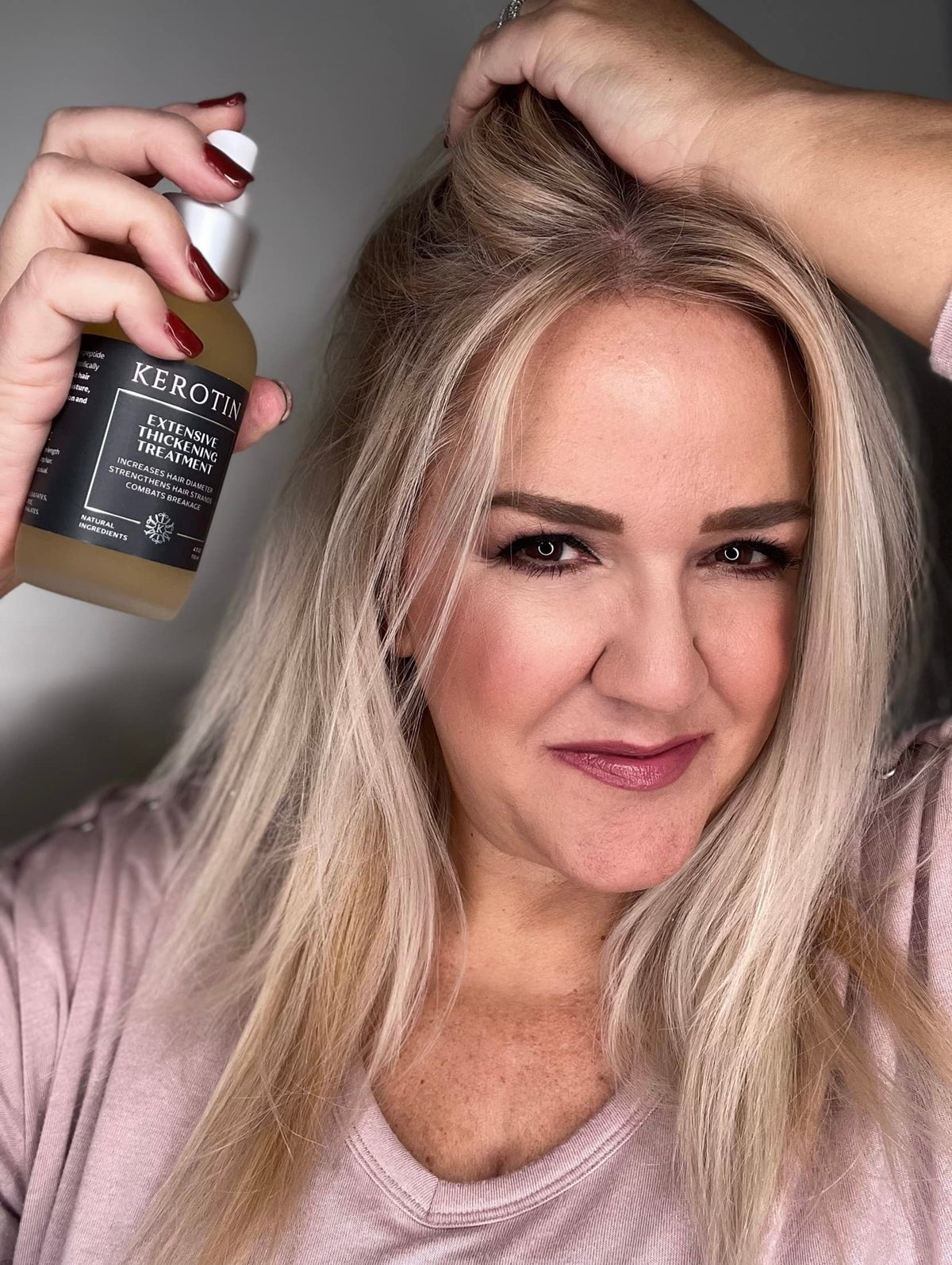 Kerotin bottle held in hand to show size and travel-friendly benefit