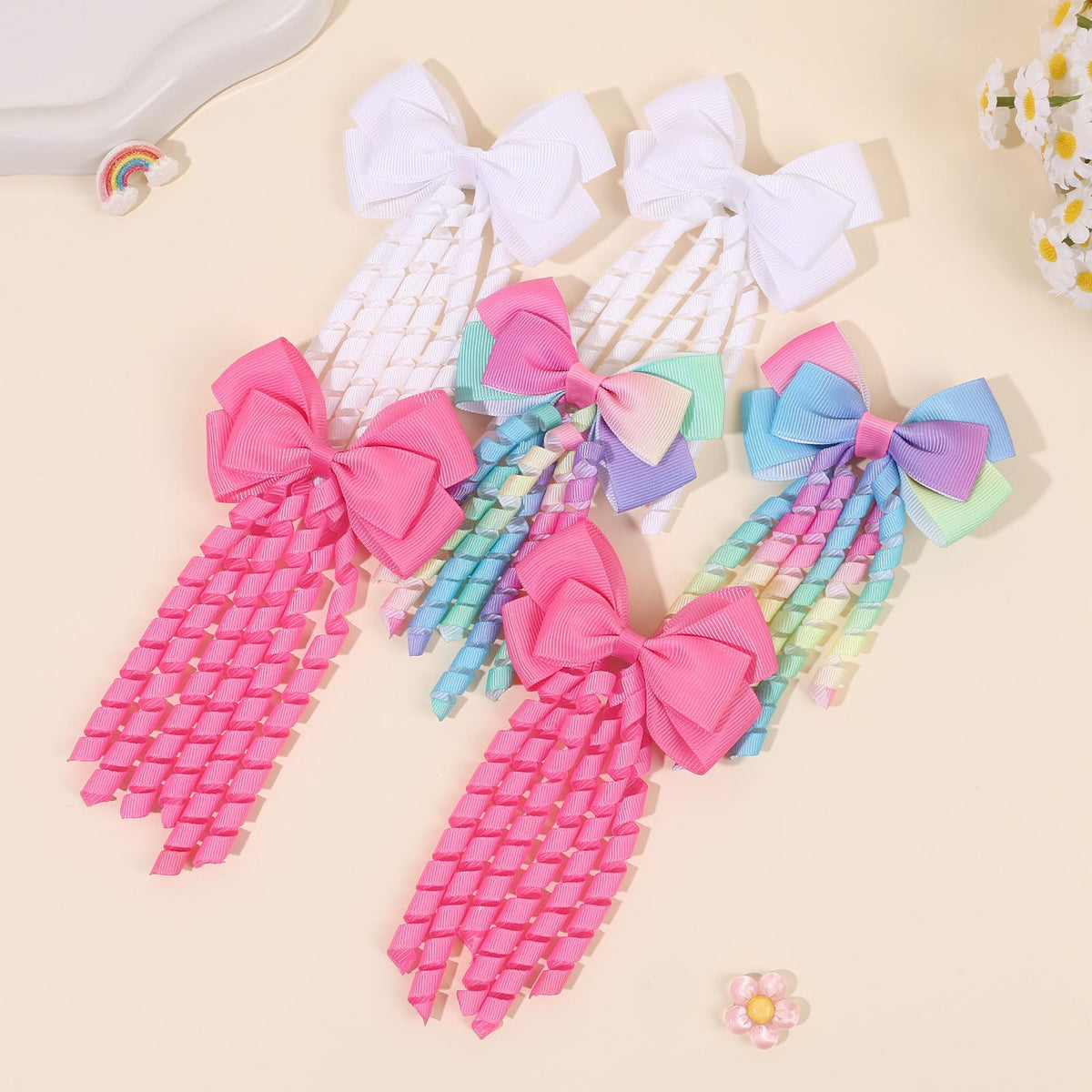 KIDSBETT bow next to a hand showing 5 inch size for scale and fit