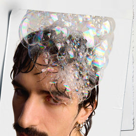 Kiehl's rich foam lather on hair demonstrating gentle cleansing benefit
