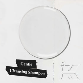 Kiehl's creamy shampoo texture on hand indicating easy application and hydration
