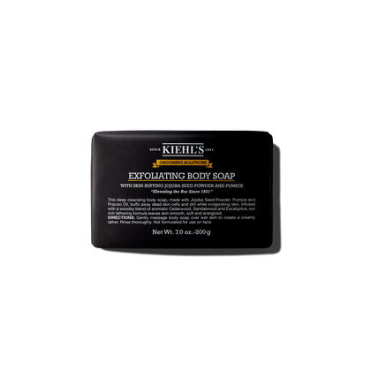 Kiehl's front packaging of exfoliating body bar showing product and woodsy scent benefit