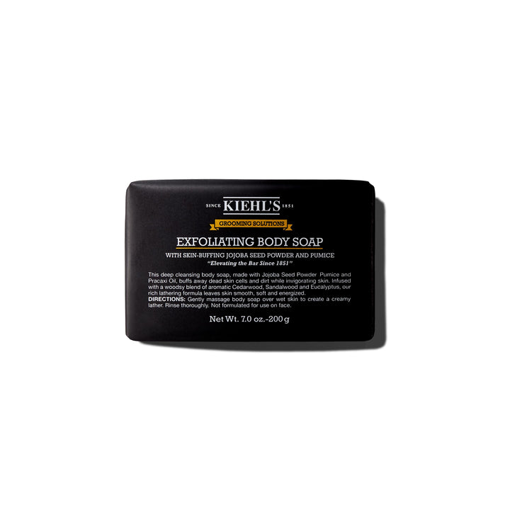 Kiehl's front packaging of exfoliating body bar showing product and woodsy scent benefit
