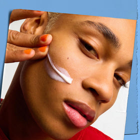 Kiehl's Ultra Facial cream being applied to fingertips showing smooth spreadability benefit