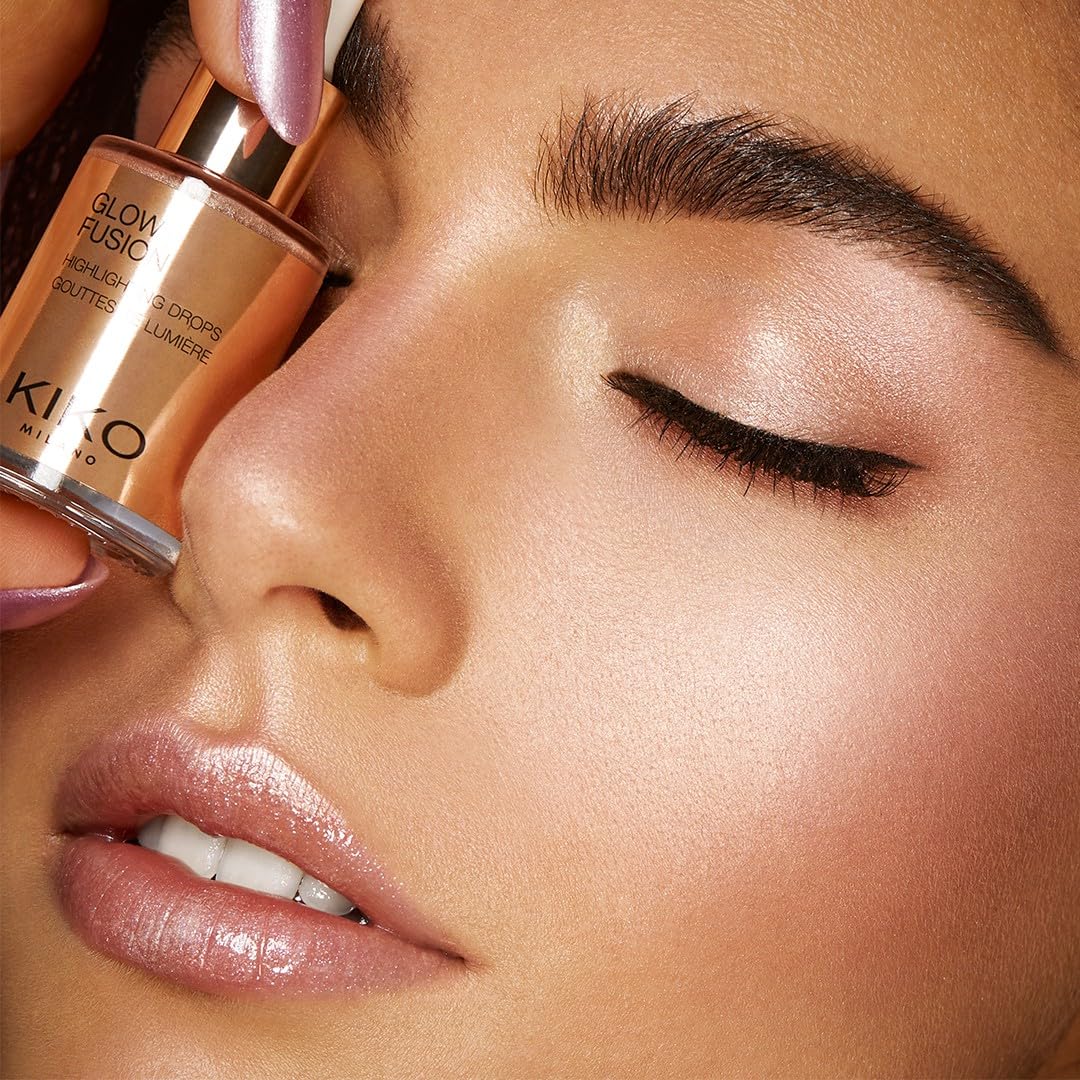 KIKO Milano bottle in hand to show size and travel-friendly benefit