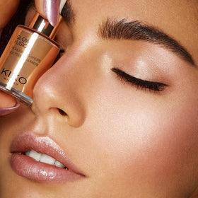 KIKO Milano bottle in hand to show size and travel-friendly benefit