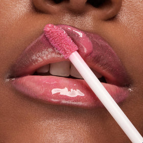 Kiko Milano tube with open cap beside ruler showing 6.5ml scale benefit: travel-friendly size