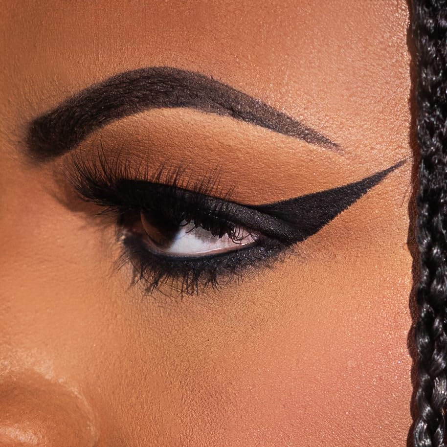 KimChiChic swatch on arm demonstrating intense black pigment payoff
