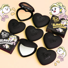 KimChiChic powder placed next to foundation and concealer for coordinated routine benefit