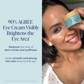 Model applying Kind Science eye cream under eye with gentle tap to illustrate proper use