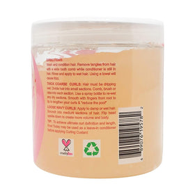 Kinky Curly applying product to damp hair for enhanced definition