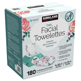Hand pulling one Kirkland Signature facial towelette from tub demonstrating easy single-handed dispensing