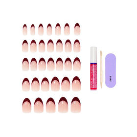 KISS glue and manicure tools laid out for quick at-home application