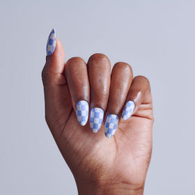 KISS close-up of Credit blue nail color highlighting smooth finish