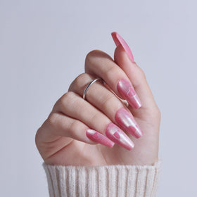 KISS close-up of single nail showing pink sugar chrome finish and detail