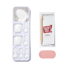KISS press-on toenail held in hand showing scale and easy placement