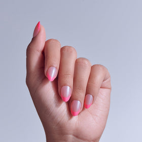 KISS close-up of almond-shaped press-on nails showing neat curvature and polish