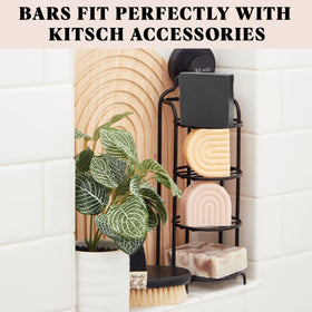 Kitsch charcoal bar held in hand illustrating 4 oz size and grip
