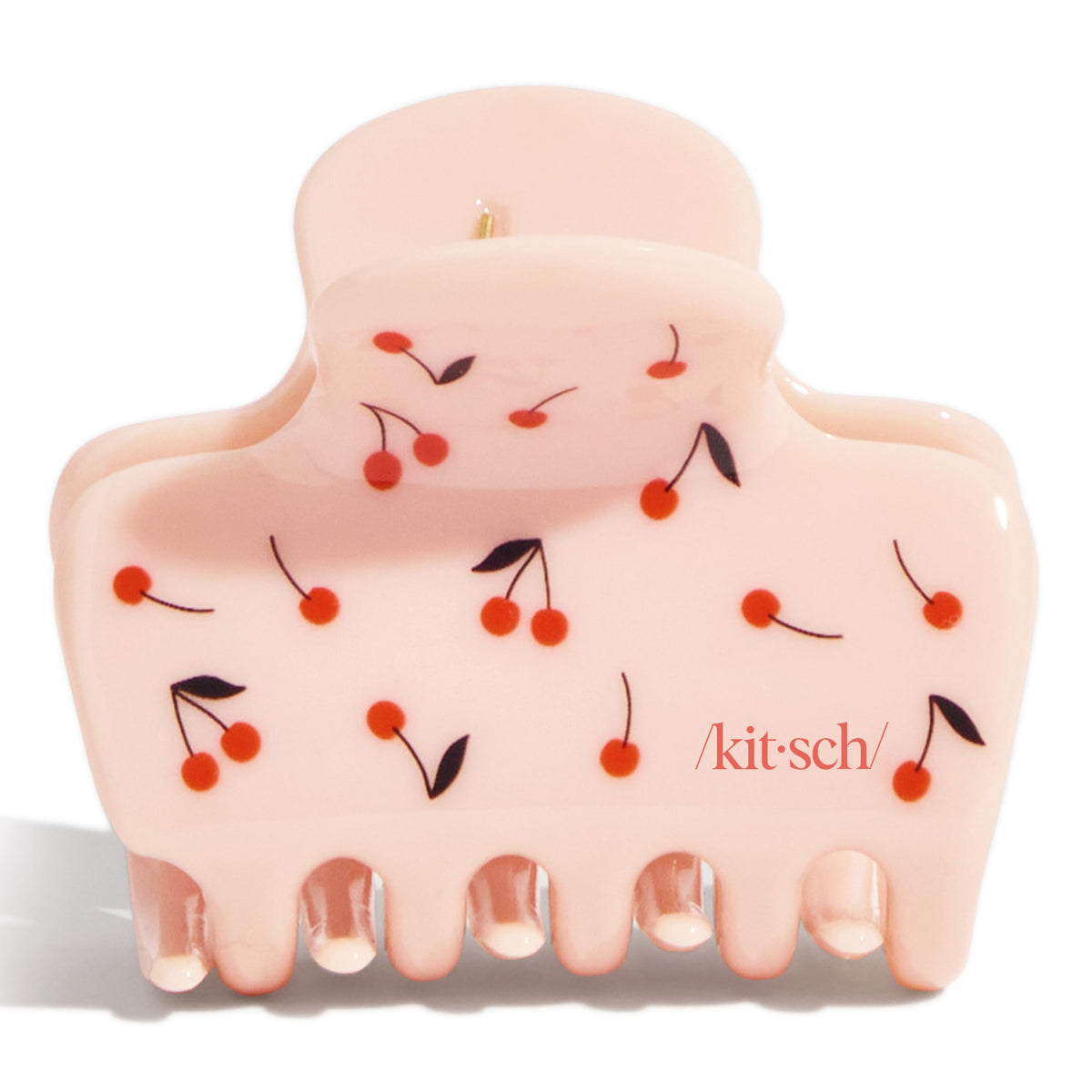 Kitsch cherry clip in a beach setting showing travel-friendly design
