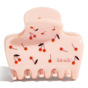 Kitsch cherry clip in a beach setting showing travel-friendly design
