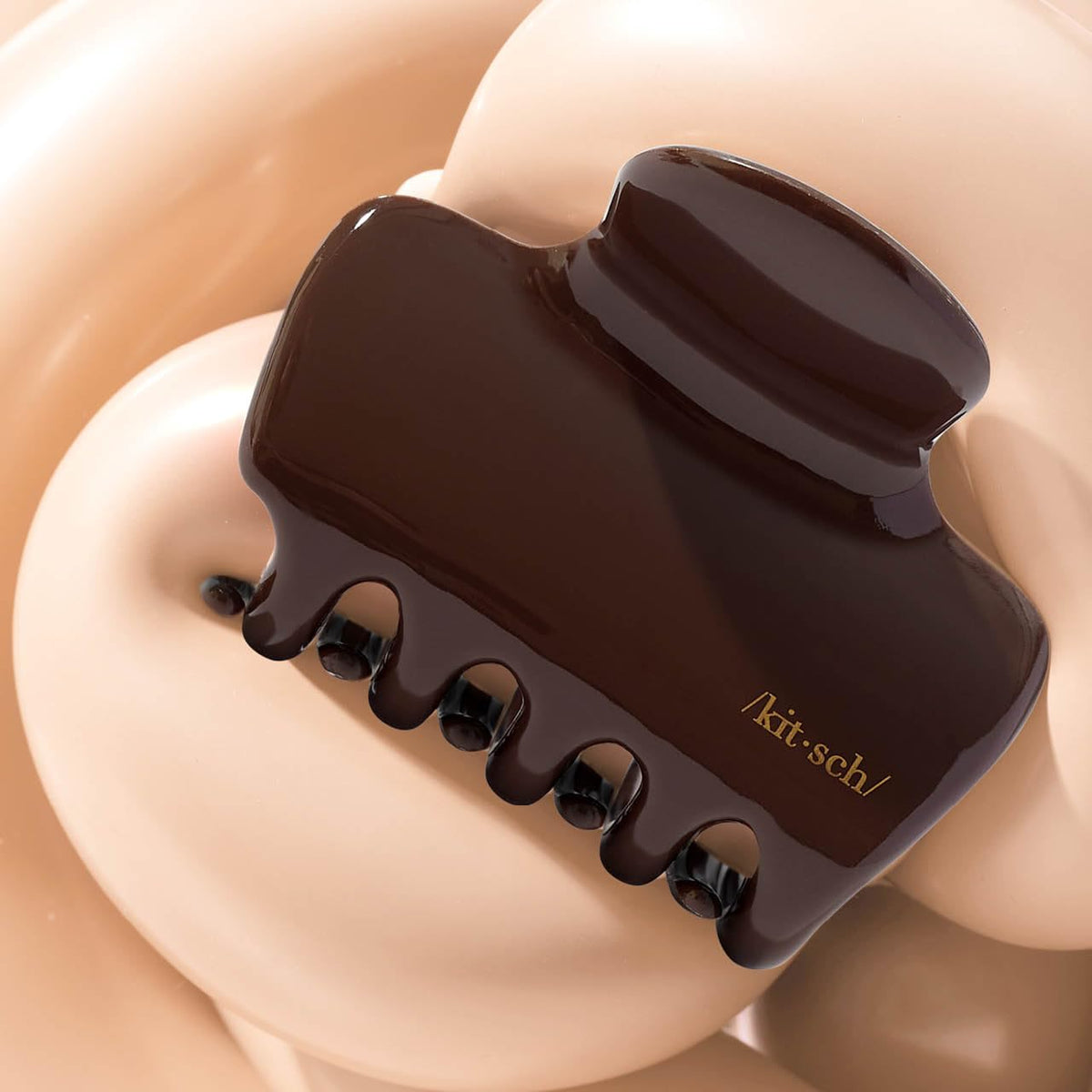 Kitsch chocolate clip surface texture close-up indicating durable recycled plastic