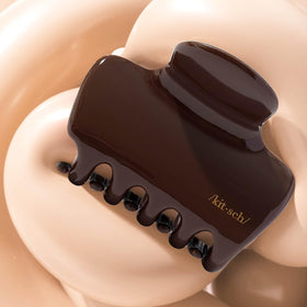 Kitsch chocolate clip surface texture close-up indicating durable recycled plastic