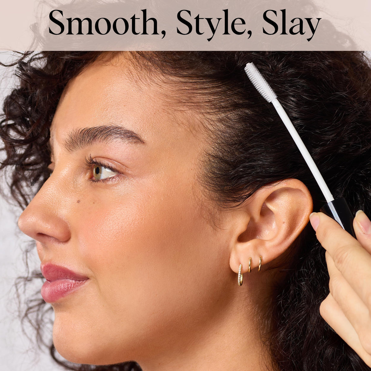 Kitsch clear formula smoothed on hair strands for instant frizz control